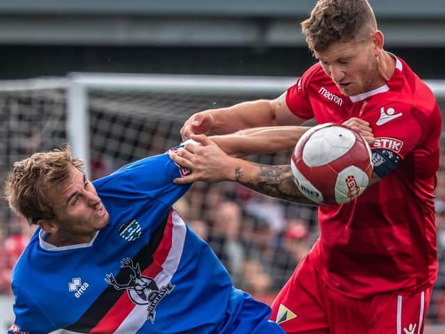 Defender Kevin Burgess, right, in action for Boro, has been retained by Marske United for the 2020-21 season
