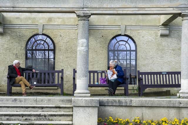 People using some of the memorial benches in the gardens. Picture: JPI Media/ Tony Johnson