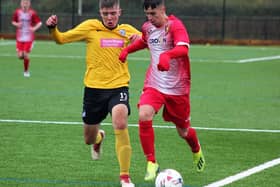 Edgehill Reserves youngster Josh Fergus gets away from Scalby Reserves Brad Smith,
