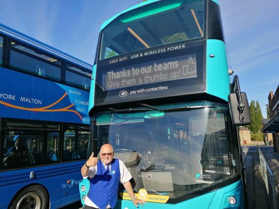 Mike Newby from bus operator Coastliner gives a thumbs-up signal as bus services increase from Sunday