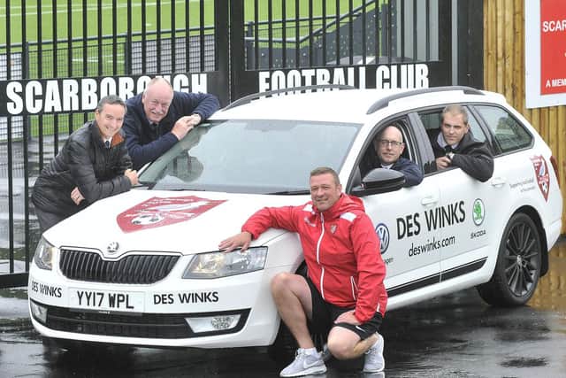 Des Winks sales manager Andy Veitch with colleagues pictured at sponsorship of a Scarborough Athletic car.