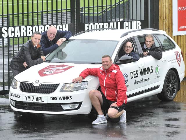 Des Winks sales manager Andy Veitch with colleagues pictured at sponsorship of a Scarborough Athletic car.