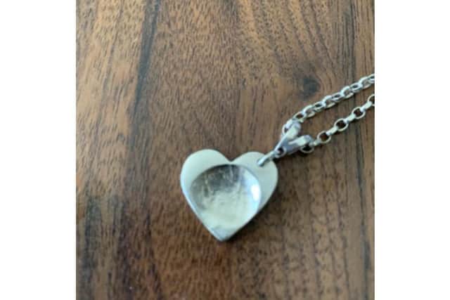 Picture of Mikki's sister's bracelet which contains a similar charm.