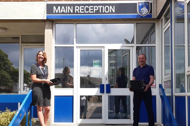 George Pindar School Principal Lesley Welsh with Matt Parsons, General Manager, External Affairs, Anglo American, with the donated laptops.