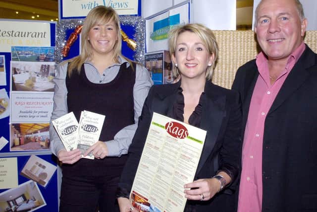 Pictured in 2009, Julie (centre) and Les Dyl with Emily Pea, from Rags.