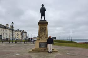 Cllr Joe Plant at the Captain Cook statue in Whitby.