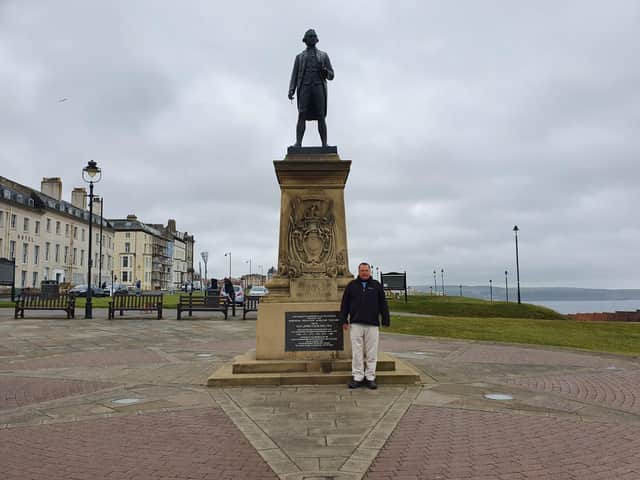 Cllr Joe Plant at the Captain Cook statue in Whitby.