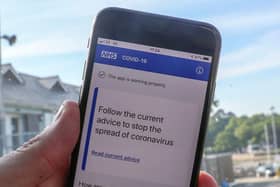 File photo of a person using the NHS coronavirus contact tracing app. The Department of Health and Social Care has said the Government will abandon its efforts to develop its own coronavirus contact-tracing app in order to focus on technology from Apple and Google. Photo: PA