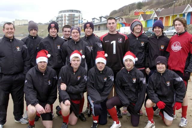 Scarborough Town's players enjoy a training session on the beach