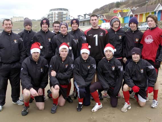Scarborough Town's players enjoy a training session on the beach