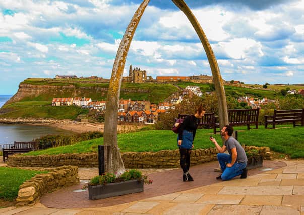 Sam Race pops the question to girlfriend Jessica Rowell by the Whitby whalebones.