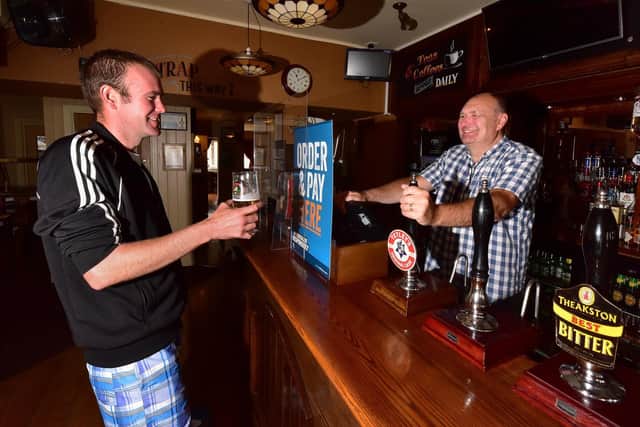 The Albert Pub opens with Ben Schofield having a pint and Michael Hirst serving.