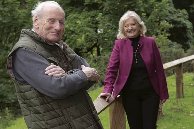 Councillor Val Arnold and Rob Cattle are pictured in Lastingham next to the new railings. Photo Submitted