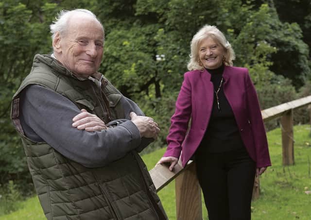 Councillor Val Arnold and Rob Cattle are pictured in Lastingham next to the new railings. Photo Submitted