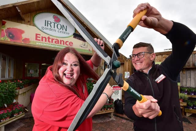 Garden Centre Receptionist Phillippa Bailey is preparing for a charity haircut, General manager Ricky Nock offers some help