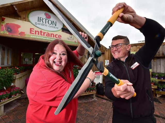 Garden Centre Receptionist Phillippa Bailey is preparing for a charity haircut, General manager Ricky Nock offers some help