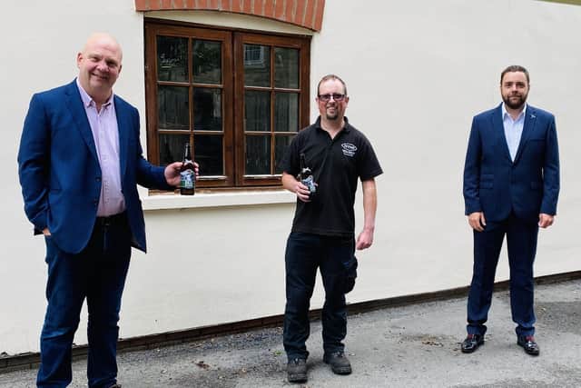 Chris Price and Piglet from the North Yorkshire Moors Railway are pictured with Antony Towle, marketing manager at Cropton Brewery.