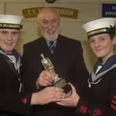 Sydney Garson presents The Stephenson Trophy to Scarborough Sea Cadets Ian Pennock (left) and Rachel Brown, in 2003.