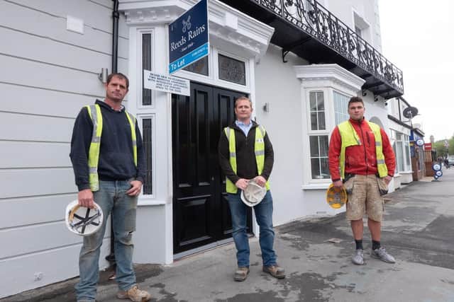 Wayne Roberts (WR Builders), Vincent Roberts (VR Property Developers), and Daniel Bradbury outside the Georgian House. The former pub has been converted into nine two bedroom apartments.