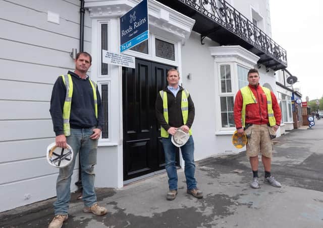 Wayne Roberts (WR Builders), Vincent Roberts (VR Property Developers), and Daniel Bradbury outside the Georgian House. The former pub has been converted into nine two bedroom apartments.