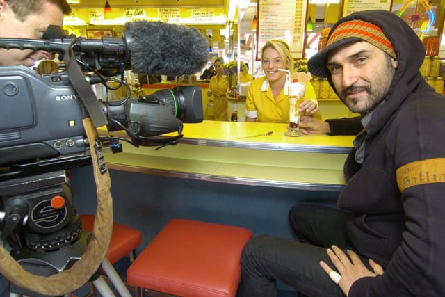 Iranian Tv presenter Behzad Bolour enjoys an ice cream in the Harbour Bar with cameraman Rory Marshall and staff member Charlotte Davis, in 2008.