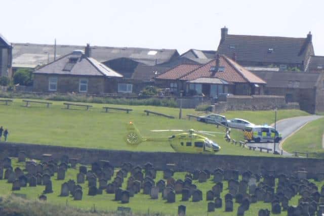 Yorkshire Air Ambulance at the scene near Whitby Abbey.