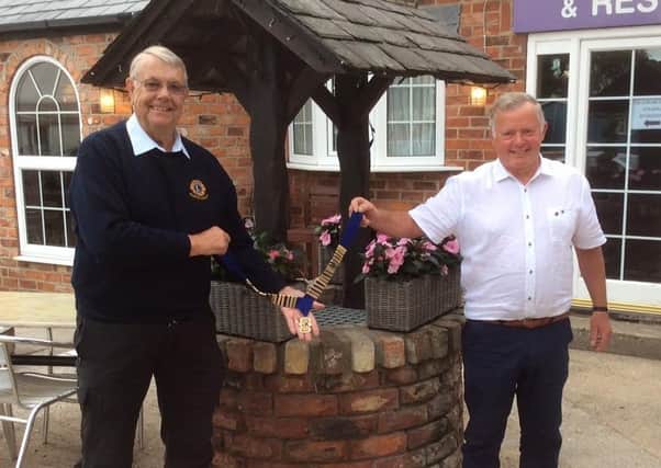 Keith Harris from Driffield (left) hands over the chain of office to the incoming president Paul Richardson from Speighton. Photo submitted