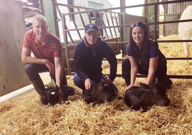 Chris Stockdale, Tom Stockdale and Chloe Stockdale with the triplets at Carr House Farm in Allerston.