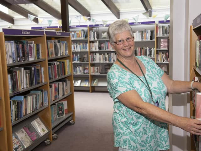 Library volunteer Lesley Bessant ready to welcome browsers back