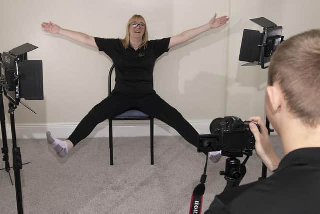 Simon and Janette filming an exercise video