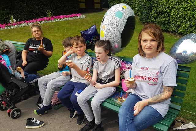 Julie Spence (right) with some of her family visiting Callum's bench