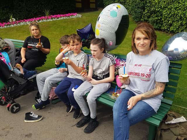 Julie Spence (right) with some of her family visiting Callum's bench