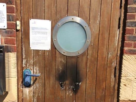 Damage to the Whitby lifeboat station door.