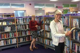 Library volunteers Jacqueline Byers (front) and Jane Pottas.