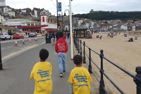 Kieran and his brothers walking along the seafront