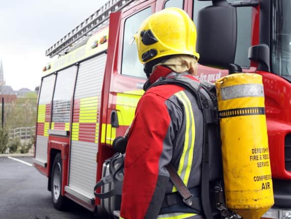 Firefighters were called to help after a motorist reversed into a building