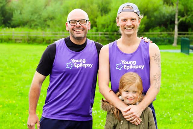 Rev Joe Kinsella is pictured with Adam Simpson and his daughter Ashleigh.