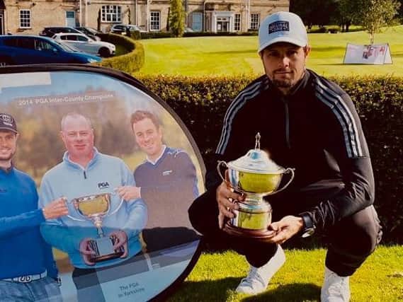 Alex Belt shows off the Yorkshire PGA Championship trophy after Monday's win