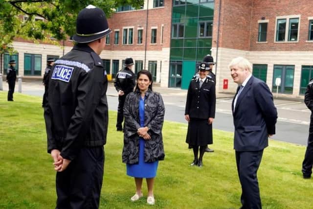 Boris Johnson and Priti Patel met officers during their visit.