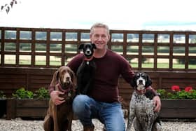 Barry White with his three dogs.