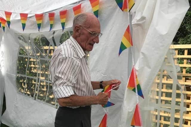 Resident Jack helps to erect gazebo.