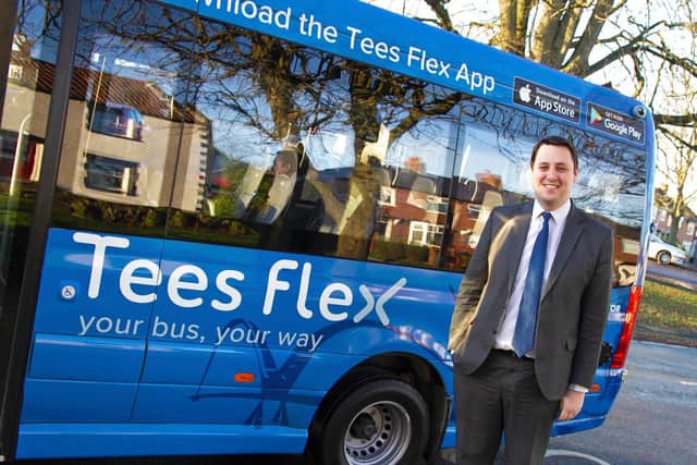 Tees Valley metro mayor Ben Houchen with a Tees Flex bus.