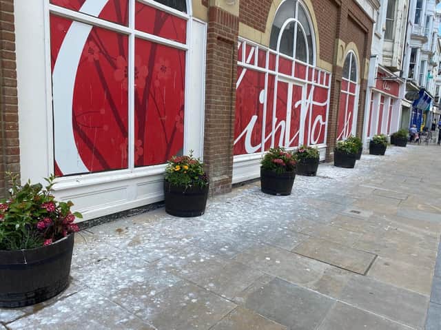 Some of the offending gull mess around the planters.