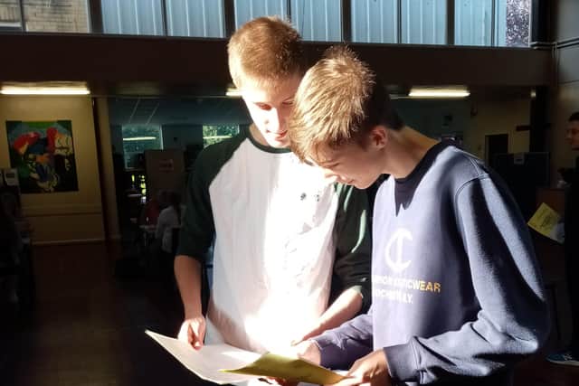 Tomas and Lucas Croft compere their GCSE results.