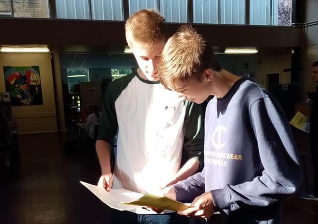Tomas and Lucas Croft compere their GCSE results.