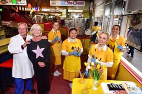 Giulian and Theresa Alonzi with staff, celebrating the 75th anniversary.