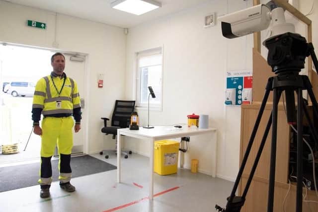 Temperature checks are carried out on staff.