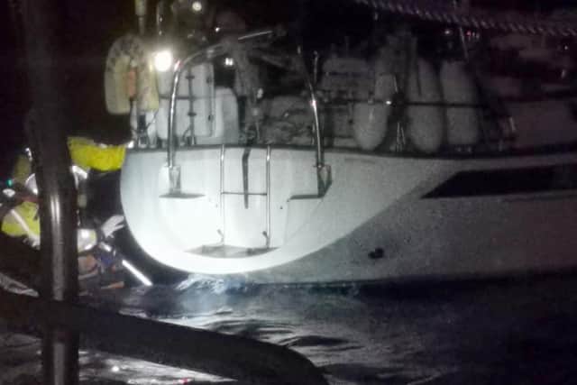 RNLI crews work to untangle the yacht from the lobster pot lines