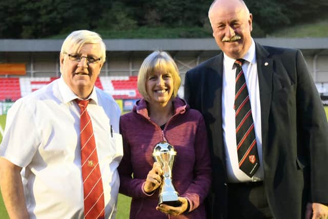 From left, at last year's Dave Holland Memorial Trophy game at Boro are, Brid Town chairman Peter Smurthwaite, Wendy Danby and Boro chairman Trevor Bull
PHOTO BY DOM TAYLOR