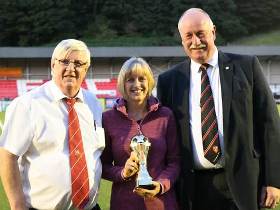 From left, at last year's Dave Holland Memorial Trophy game at Boro are, Brid Town chairman Peter Smurthwaite, Wendy Danby and Boro chairman Trevor Bull

PHOTO BY DOM TAYLOR